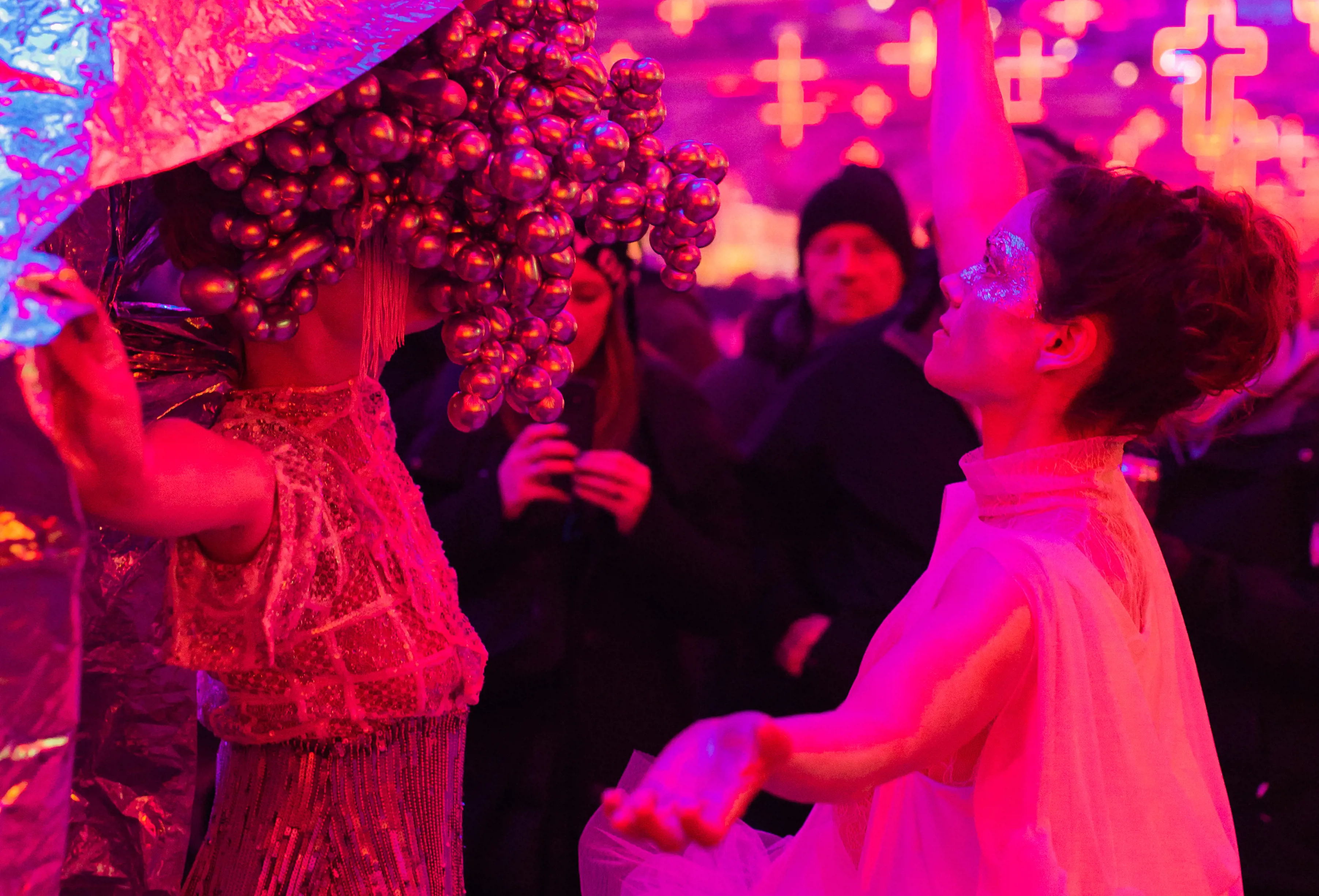 Performance artists in costume mingle amongst the crowd at the Dark Mofo Winter Feast. 