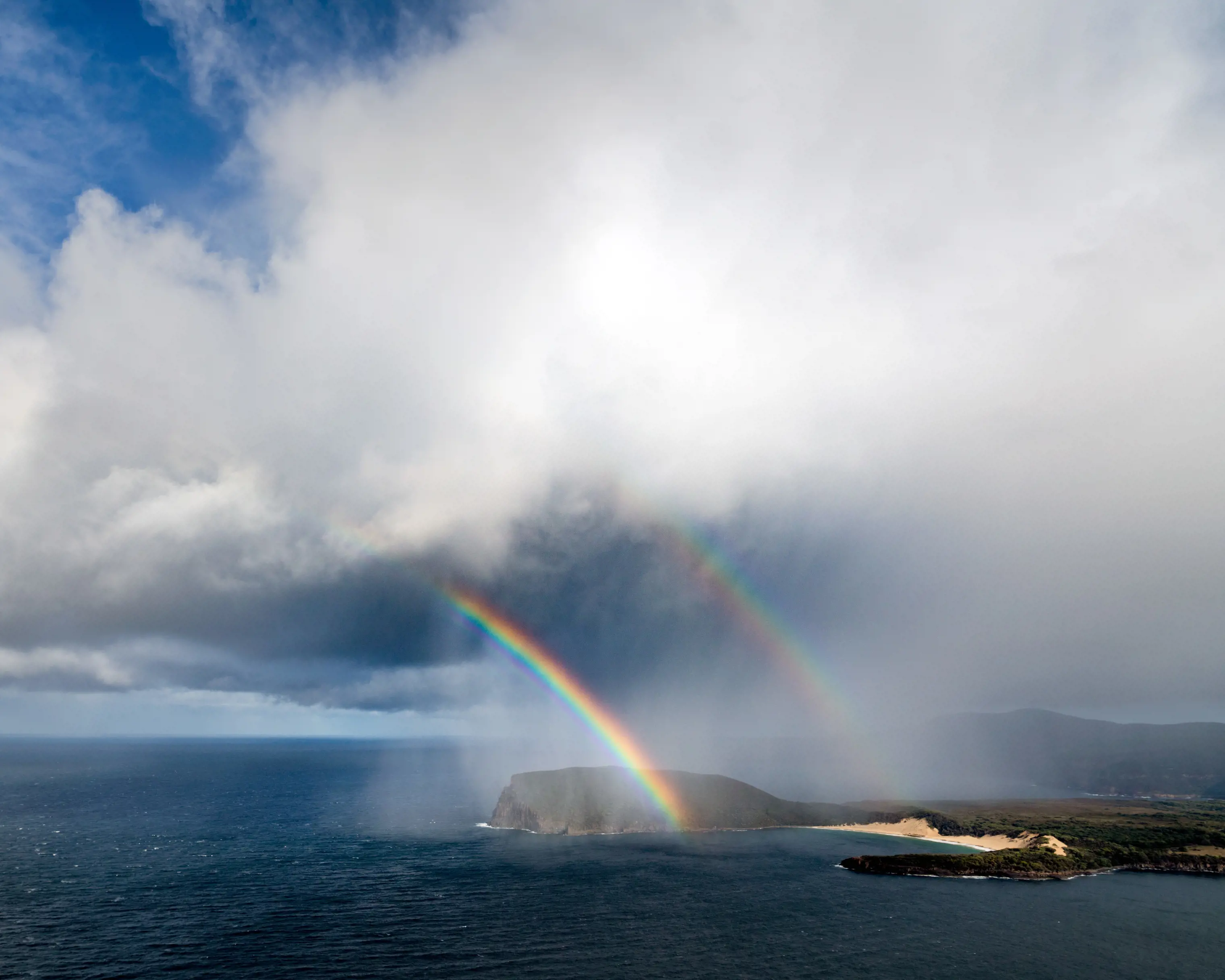 Rainbow over Crescent Bay, Tasman National Park