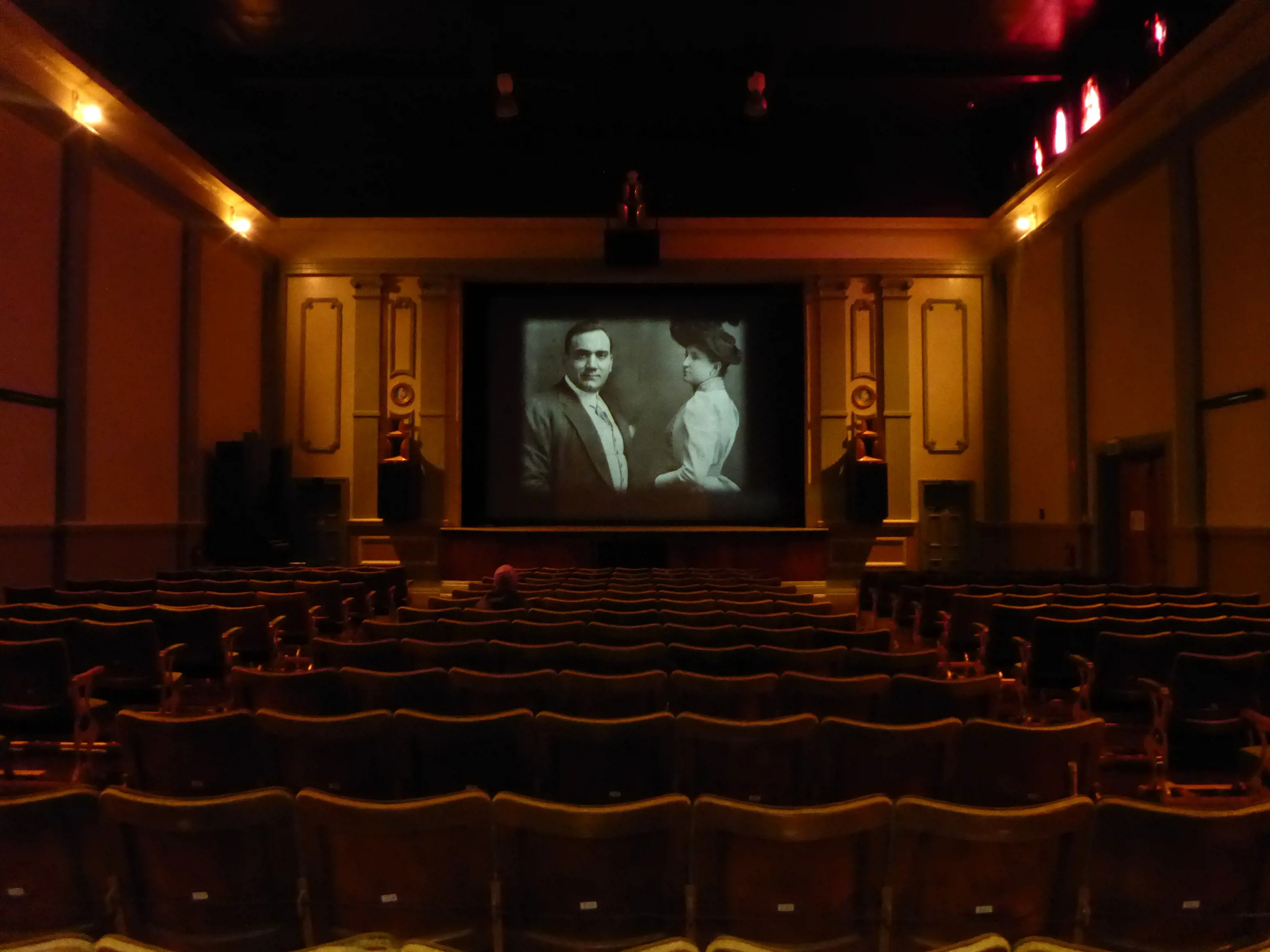 Interior of a person on their own seating facing the screen in Gaiety Theatre, Zeehan.