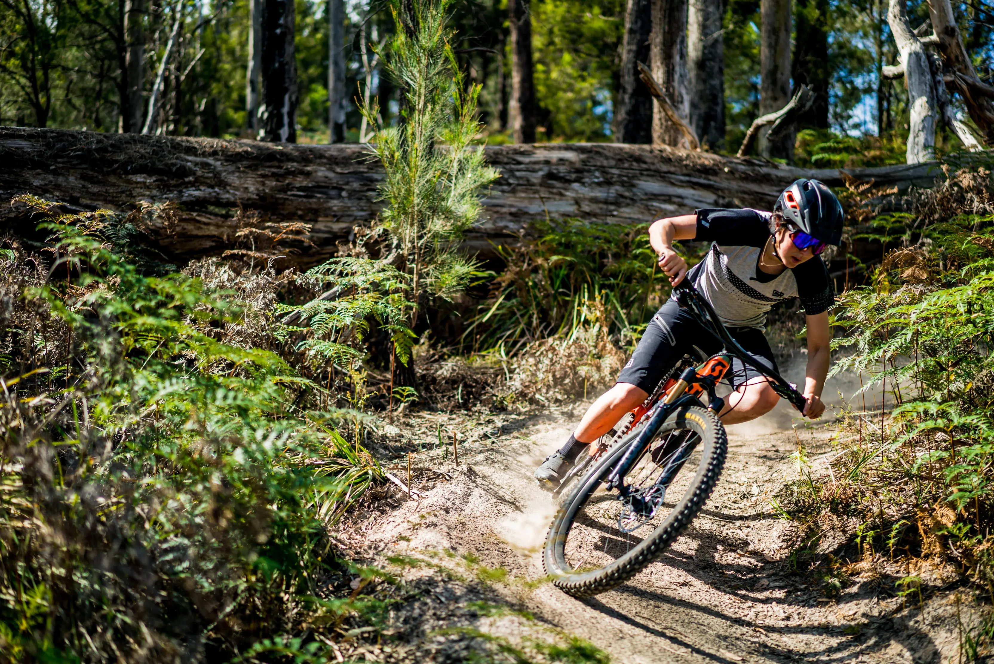 A cyclist focuses on their way down at Wild Mersey Mountain Bike Trails