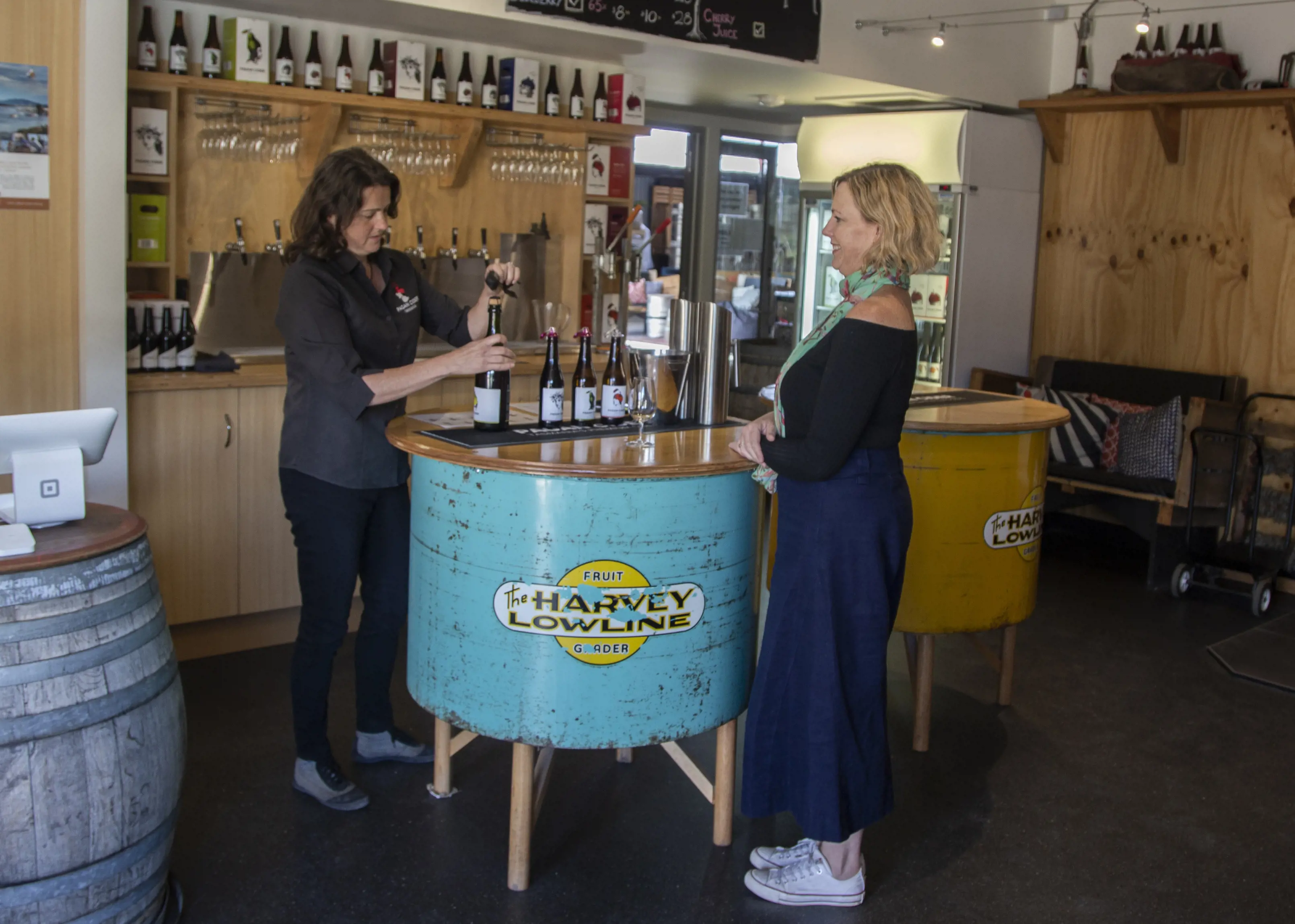 Two women sampling ciders at the Pagan Cider Cellar Door, Cygnet.