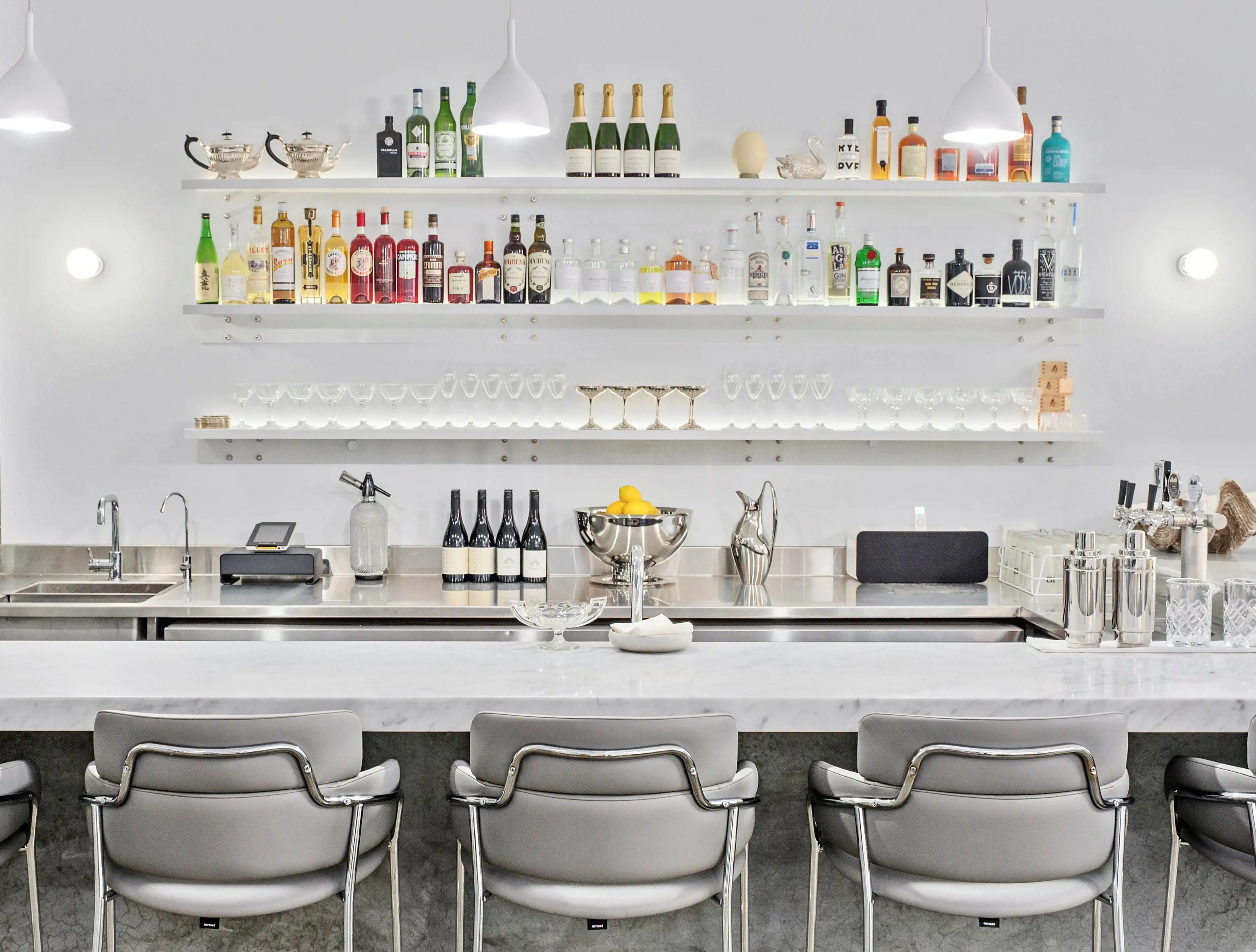 The marble bar area for tasting experiences at Institut Polaire wine and spirits bar.