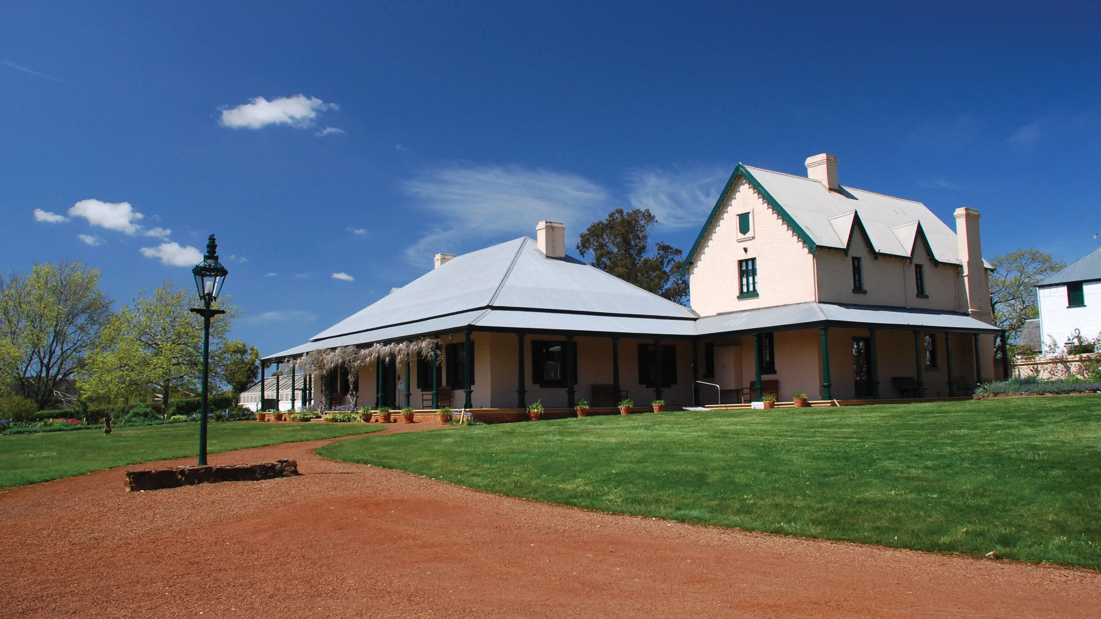 Exterior of Entally House, an old house built in 1819. It is surrounded by gardens and grounds.