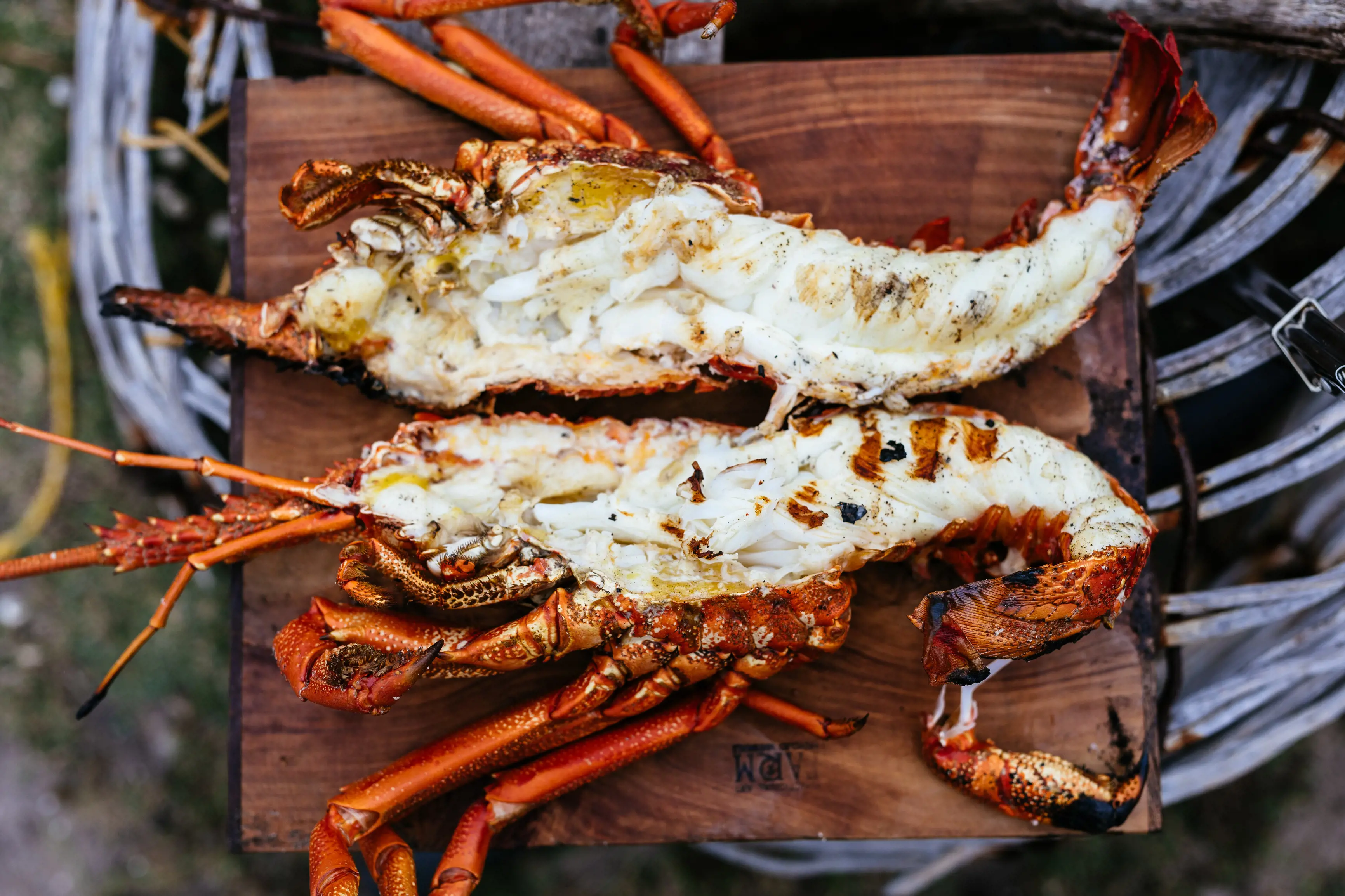 Close up image of a mouthwatering cooked crayfish cut in half.