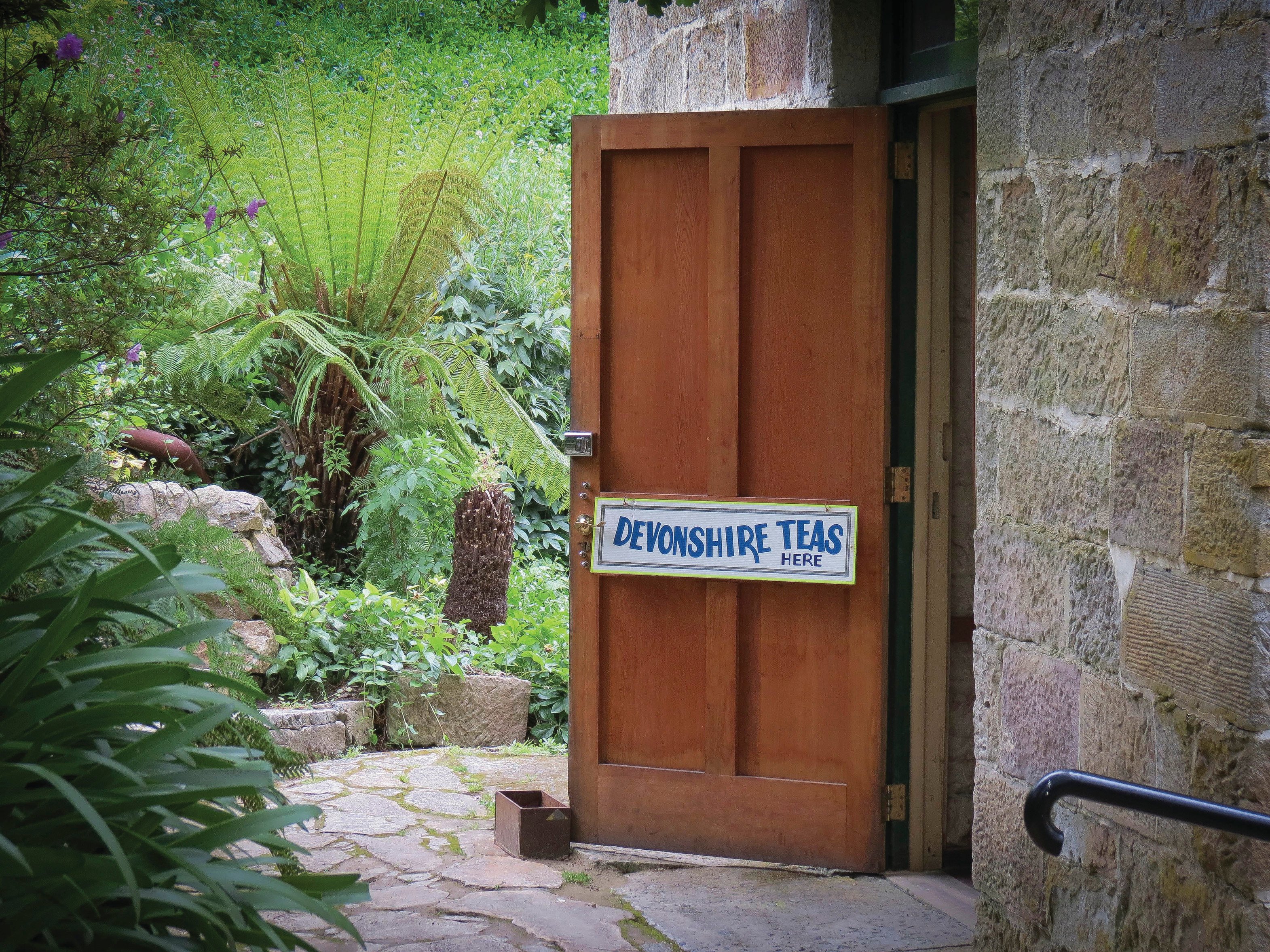 An open door at The Shot Tower Cafe, with tearooms and garden courtyard dining.