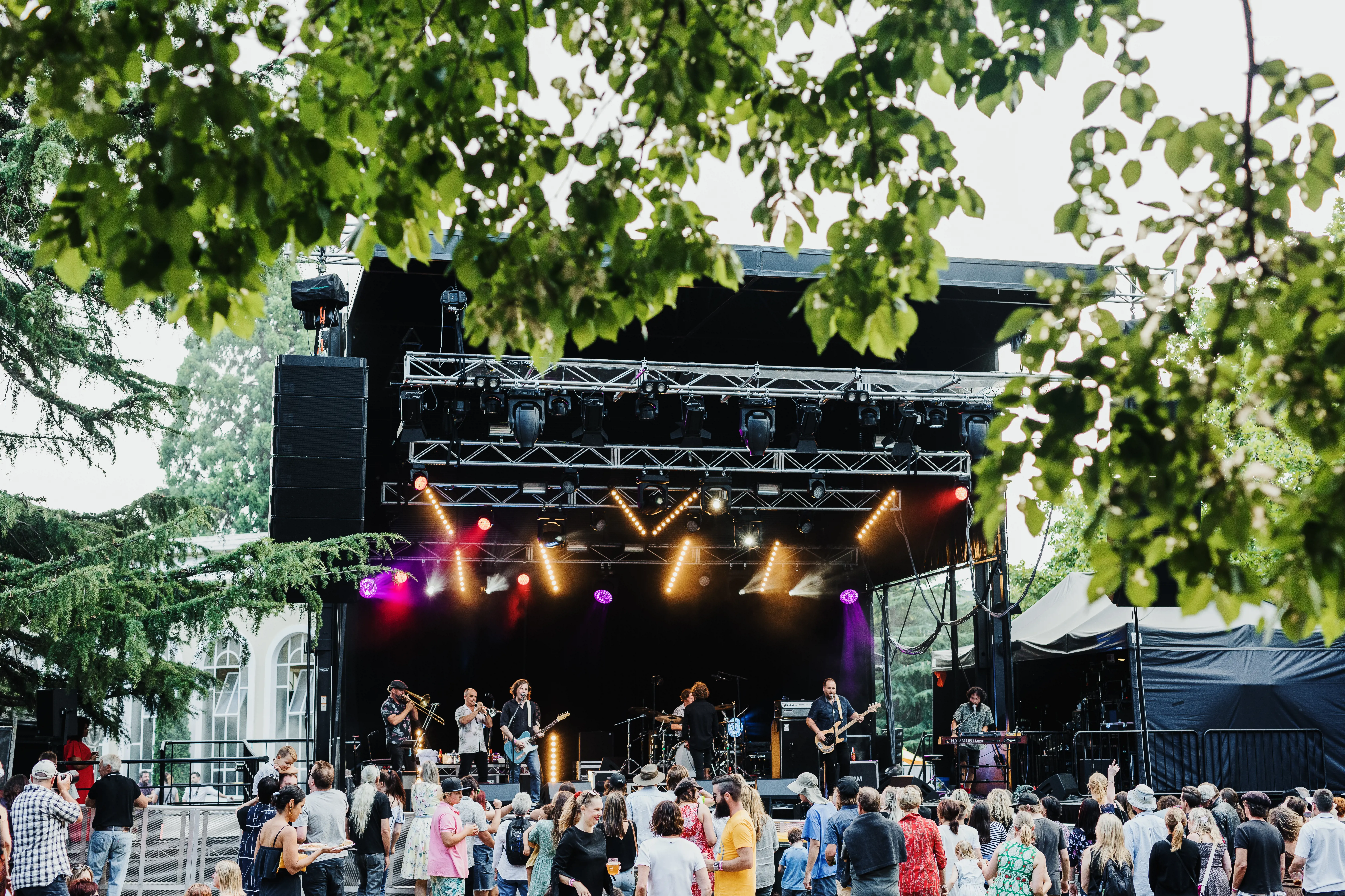 A large crowd of festival goers enjoy the music playing from a large stage at Launceston's Festivale.