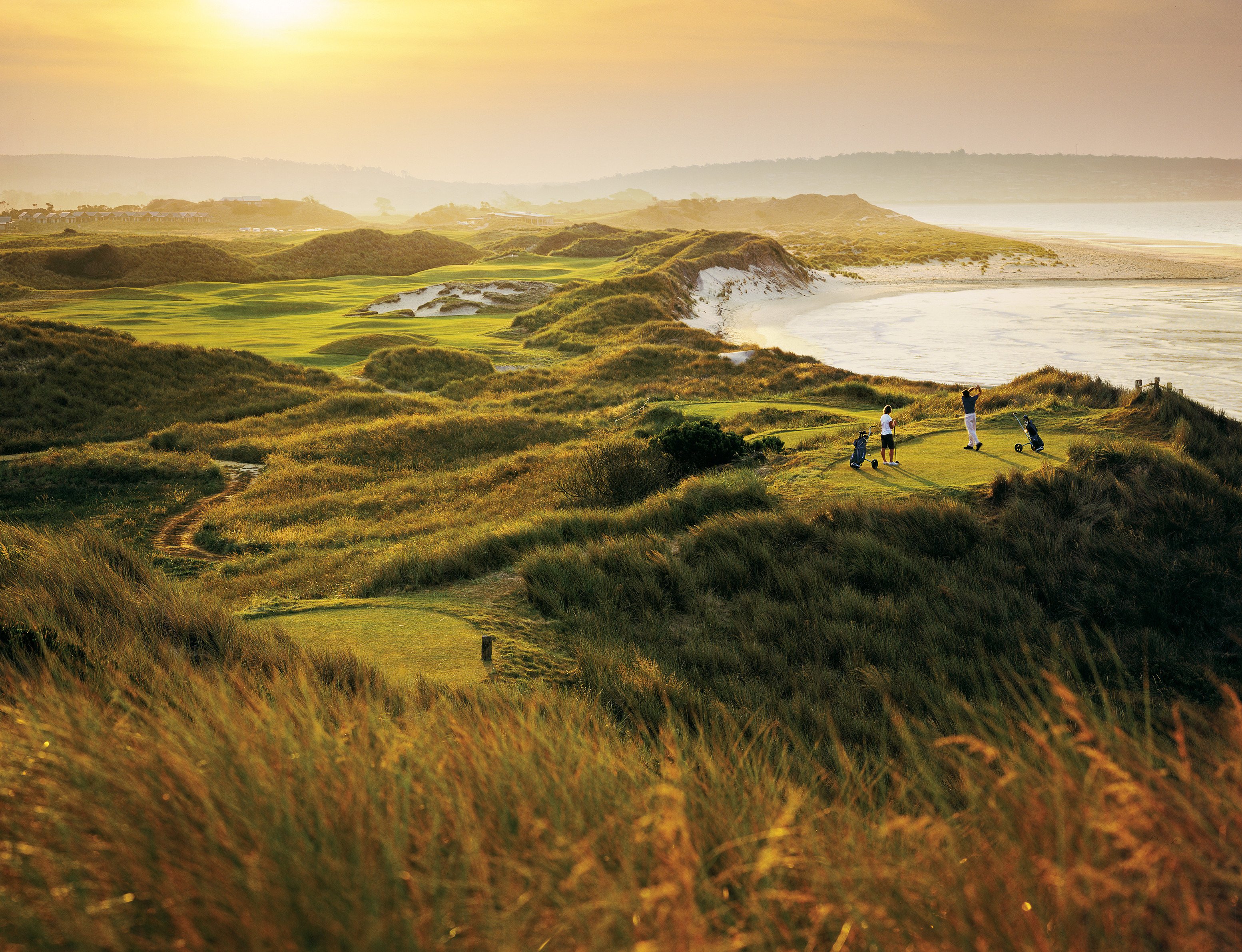 Golfers play at Barnbougle golf course, set on 200 acres of undulating coastal dunes.