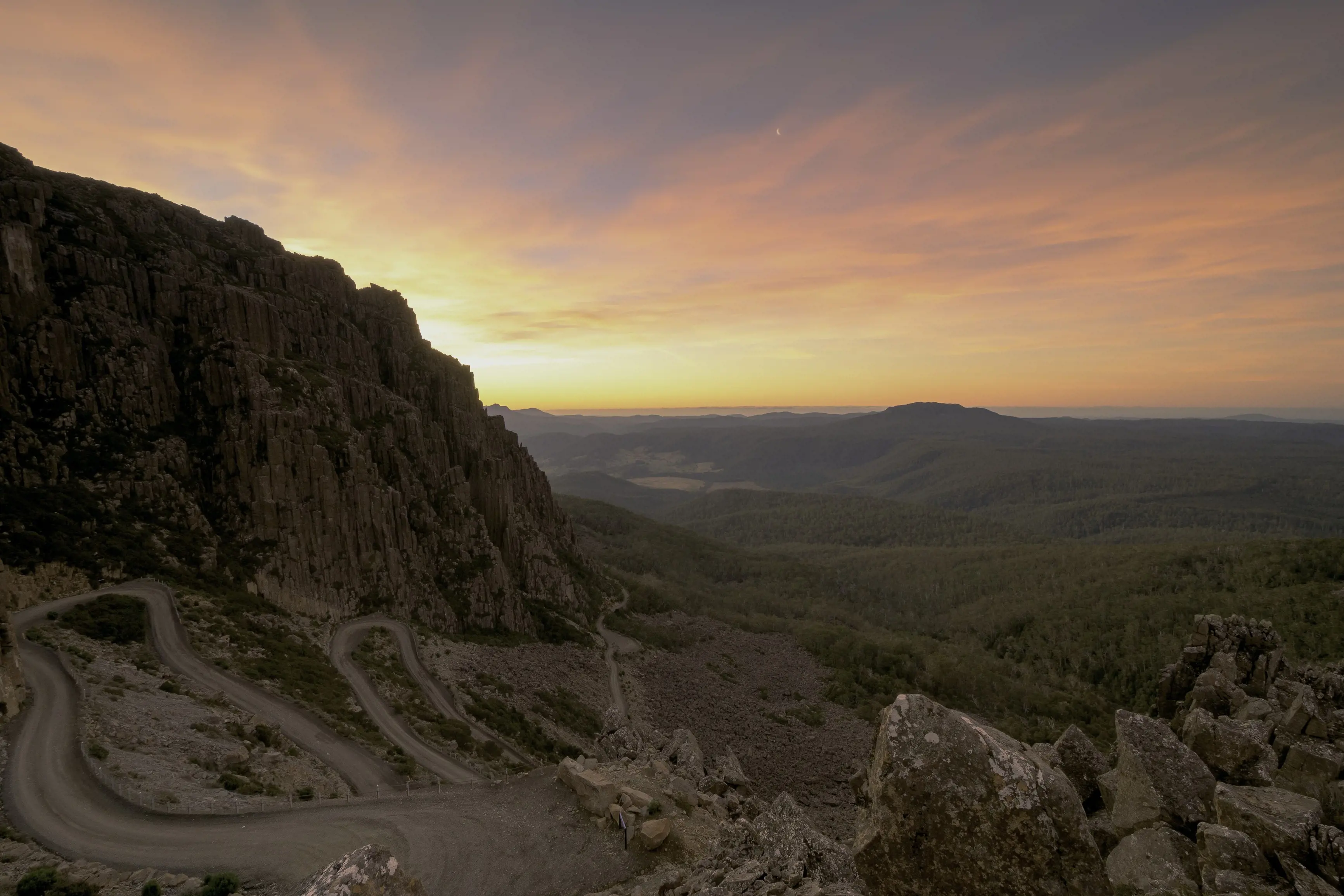 Stunning image Jacob's Ladder, Ben Lomond National Park, during a colourful, Its stark, treeless landscape fills the foreground.