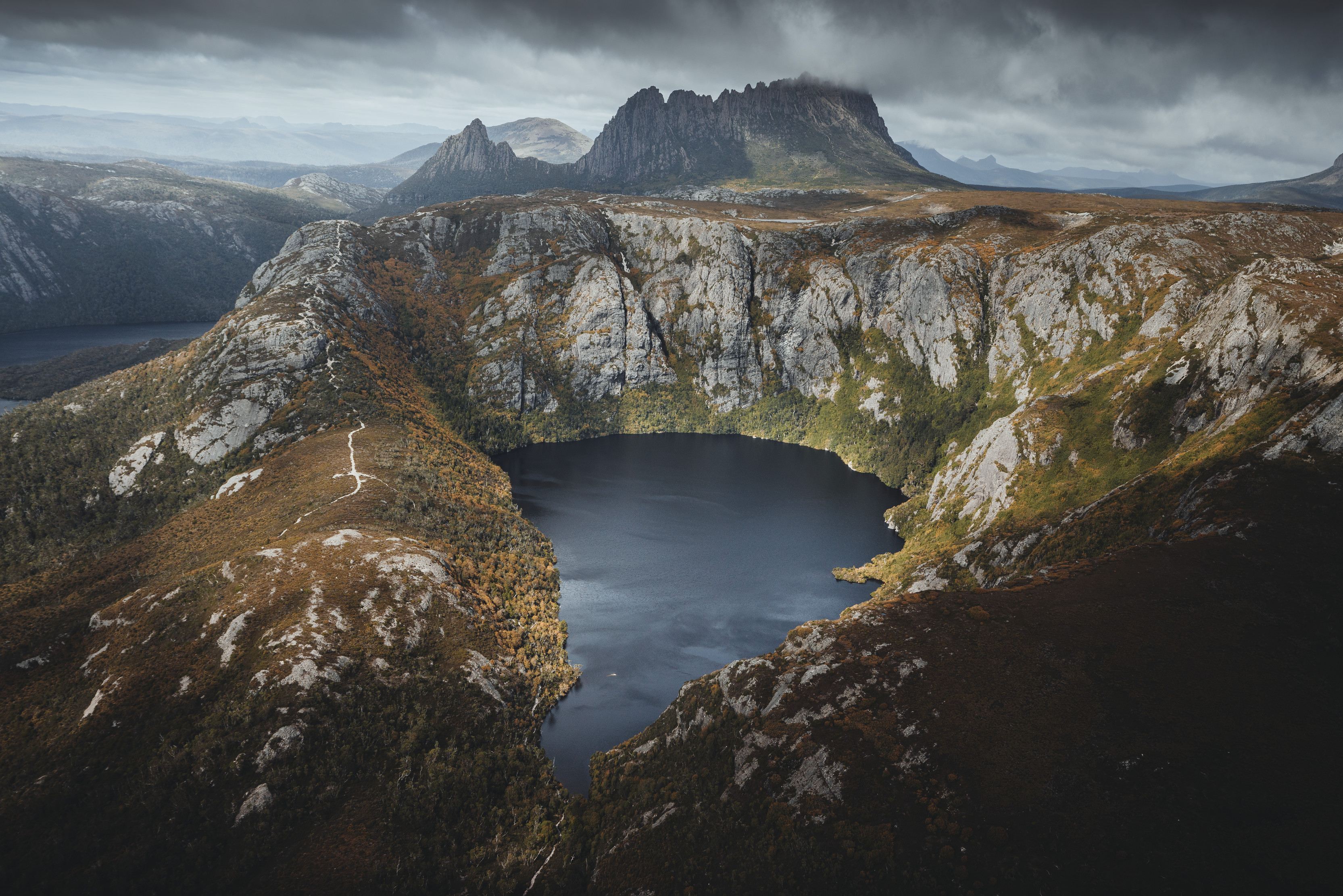 Jaw-dropping and moody aerial image of Crater Lake, Crater Mountain. 