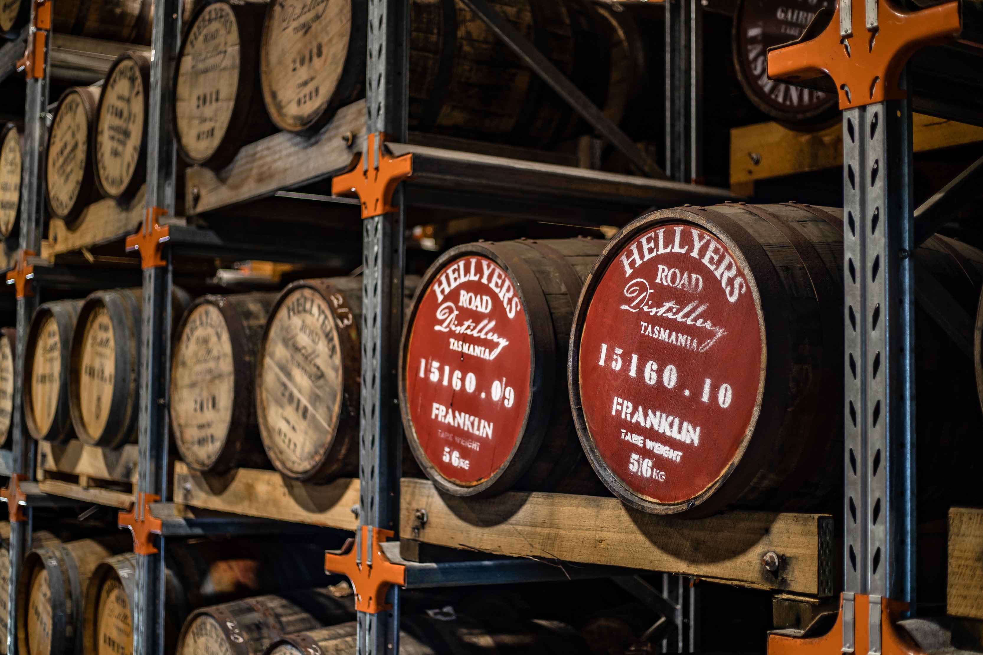 Stacks of barrels taken from an angle inside Hellyers Road Distillery.