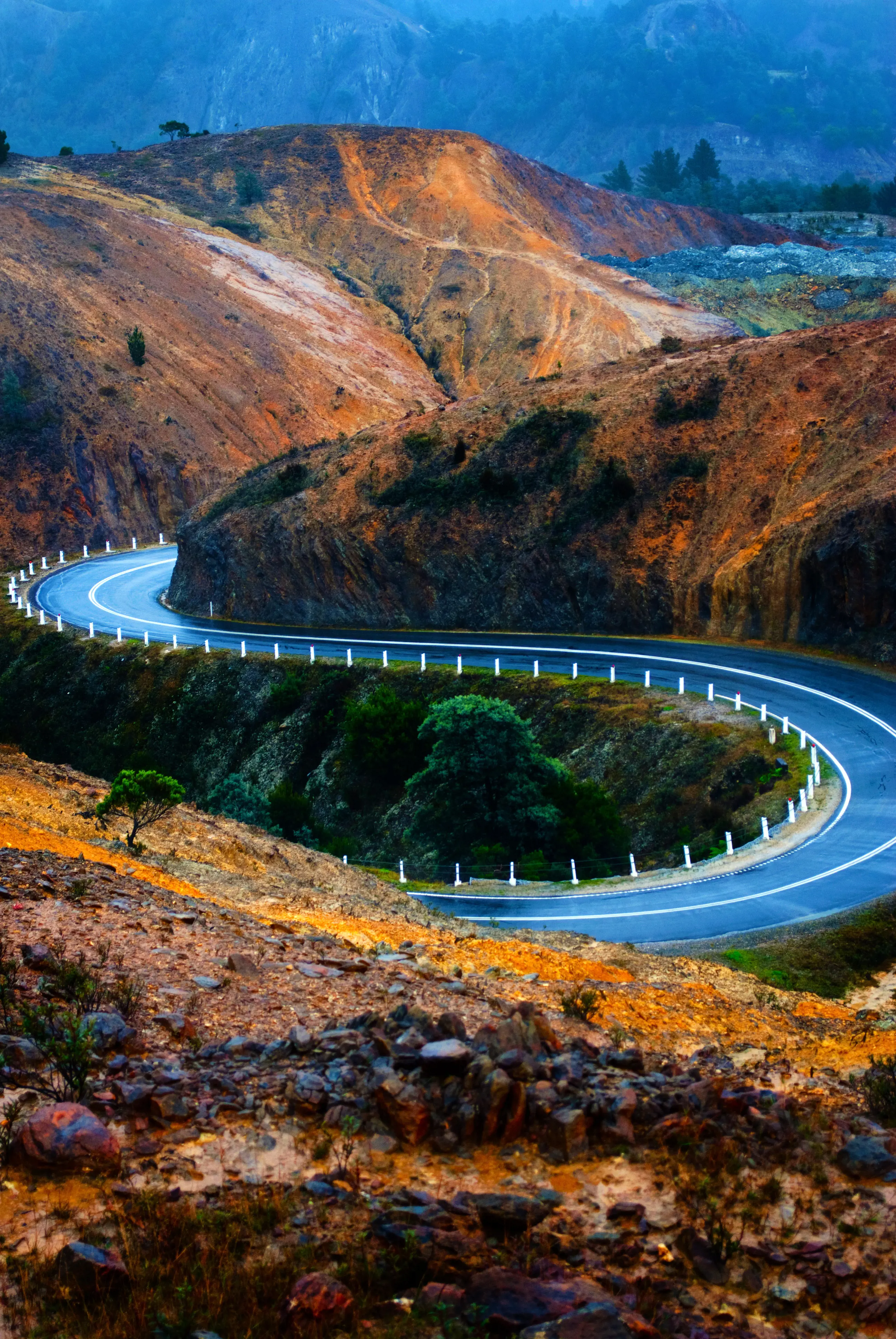 Incredible view of the road into Queenstown, surrounded by dramatic hills and mountains.