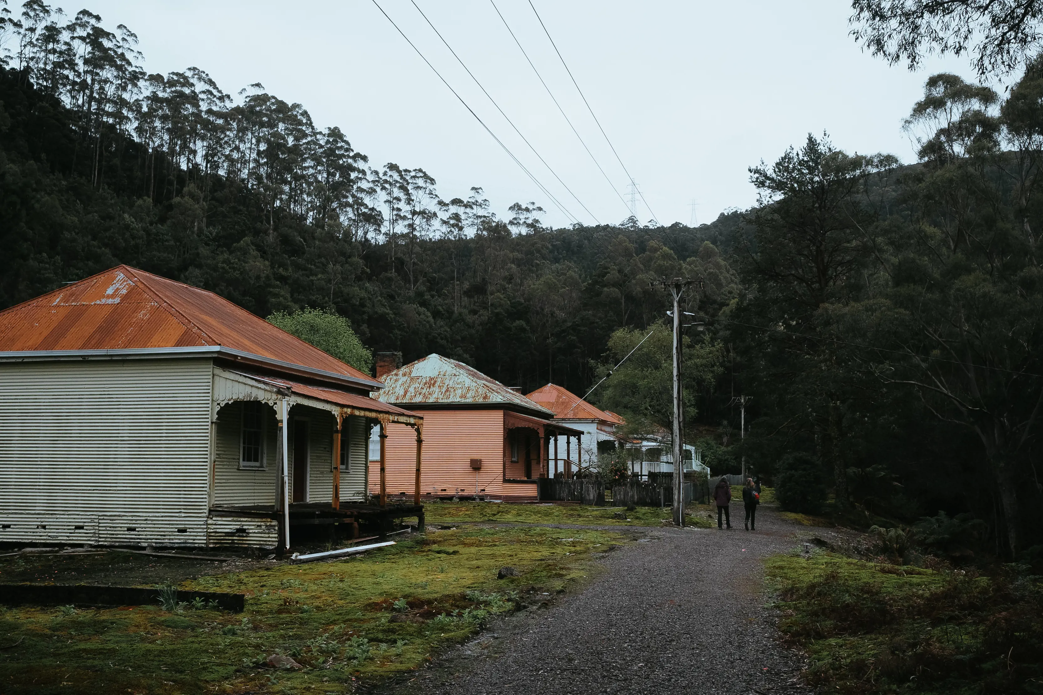 Image of three old huts within the Lake Margaret Hydro Village.